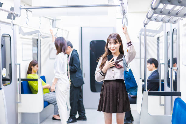 istock High school girls commuting to school by train 1368399026