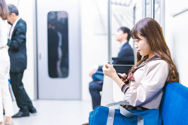 istock High school girls commuting to school by train 1368399034
