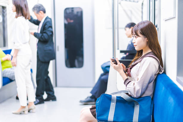 istock High school girls commuting to school by train 1368399036