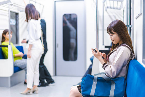 istock High school girls commuting to school by train 1368399043