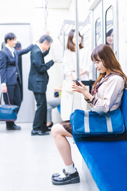 istock High school girls commuting to school by train 1368399051