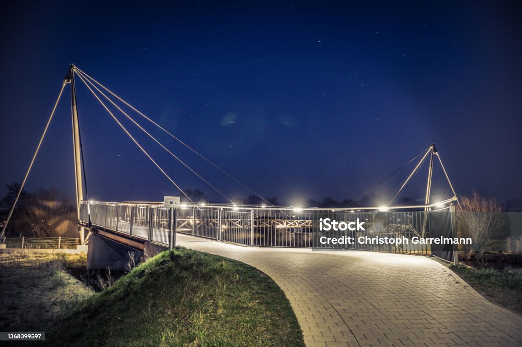 Walk on the bridge A bridge lightened by some lights Meppen Stock Photo