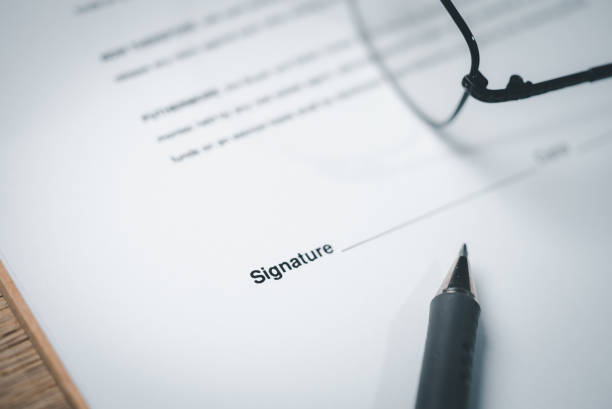 istock Close Up of Pen on docunent contract agreement sign on document paper 1368401129