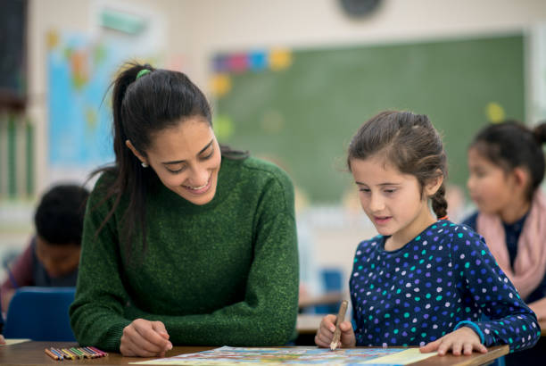 istock Working with the Teacher in Geography Class 1368401244