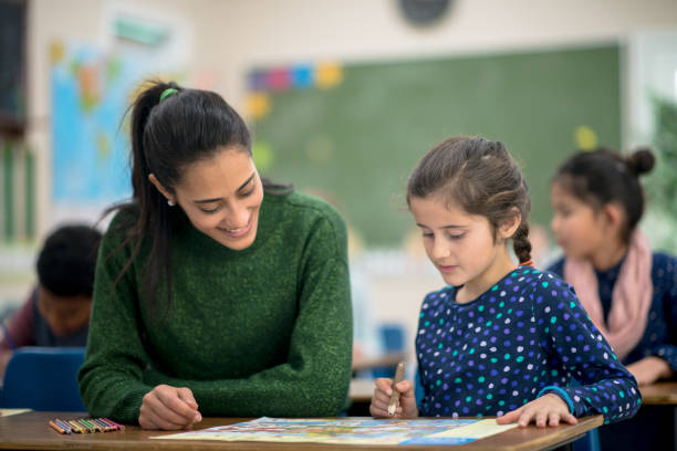 istock Working with the Teacher in Geography Class 1368401246