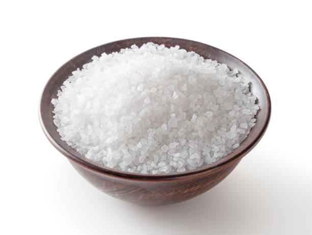 istock Sea salt in ceramic bowl isolated on white background with clipping path 1368401524