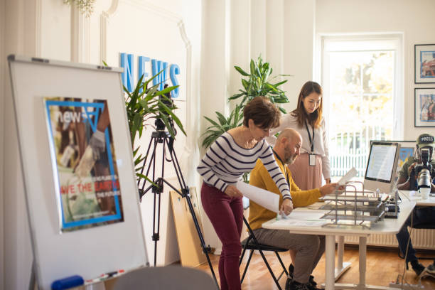 istock Multiracial magazine editors, working at editorial office 1368402862