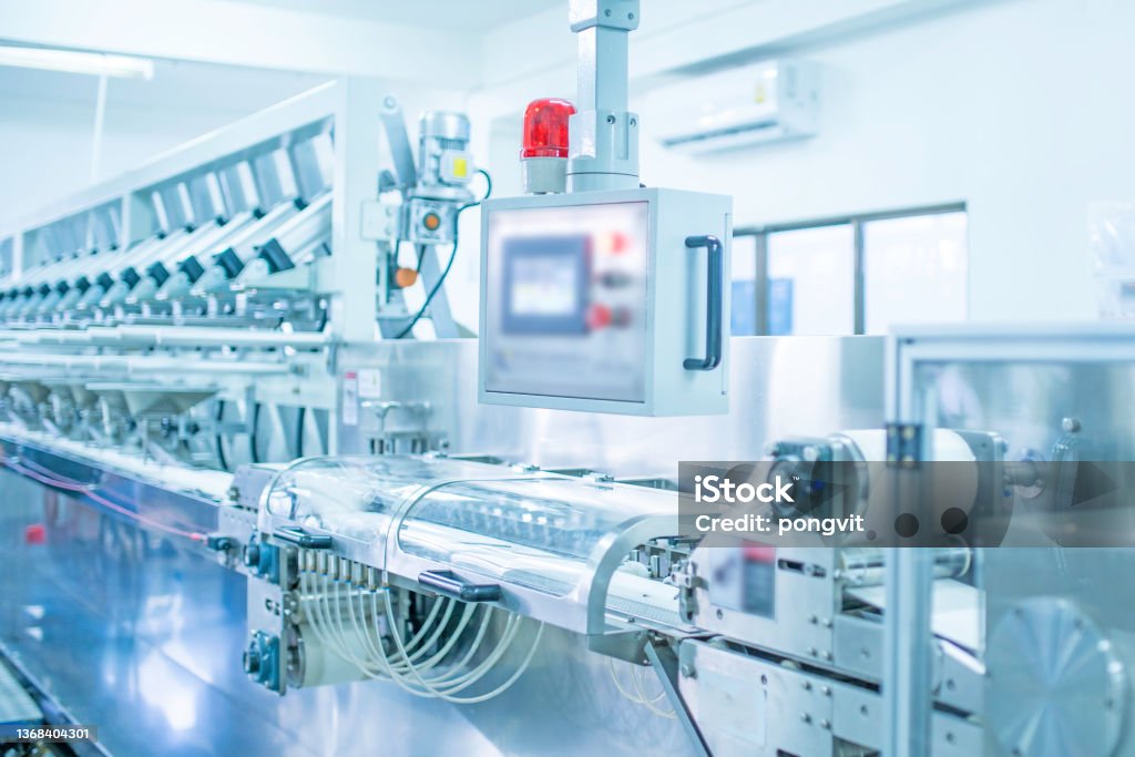 factory, industrial area, automation, technology, Machines for packing products Within the factory, sterile beauty industry in order to maintain maximum cleanliness.shallow focus effect."n Medicine Stock Photo