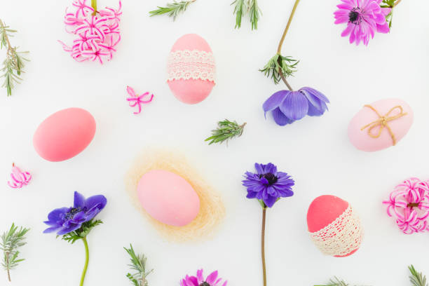 istock Ester composition with pink eggs, spring flowers and leaves of lavender on white. Flat lay, top view 1368405225