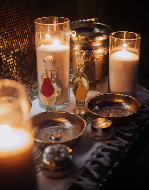 istock Essential oils with various herbs and flowers near candles 1368405346