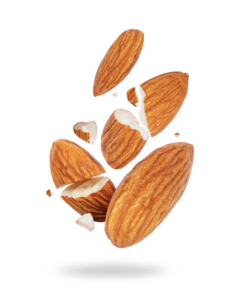 istock Cracked almonds close-up in the air on a white background 1368406151