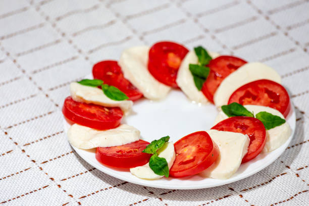 Classic Caprese Salad with Tomato, Mozzarella, Basil, Olive Oil and Balsamic Vinegar Glaze