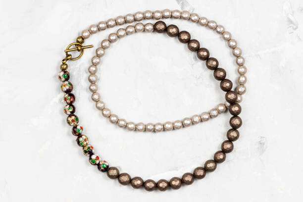 tangled necklace from faceted nacre beads on gray