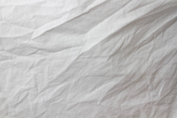 istock Wrinkled sheet. White fabric close-up. Burlap texture. Sheet on the bed. 1368410612