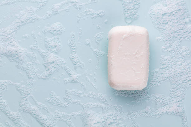 istock Soap bar and foam on white background, top view. Mockup for design 1368414017