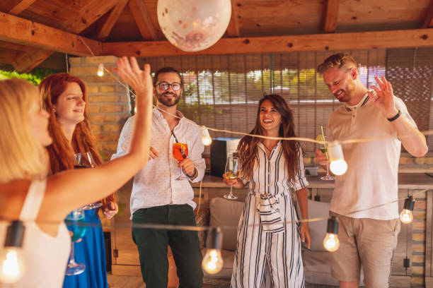 istock Group of people having fun at birthday party 1368414686