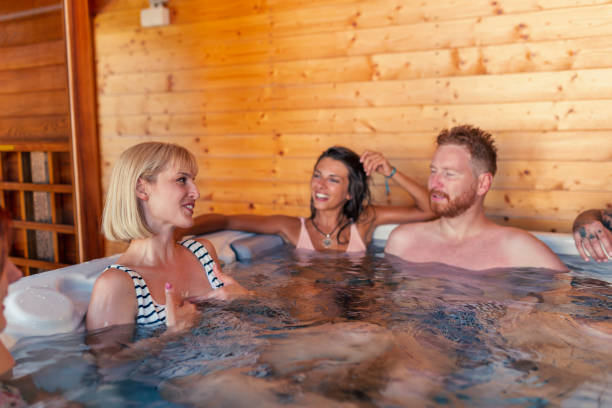 istock Friends relaxing in hot tub while on vacation 1368415390