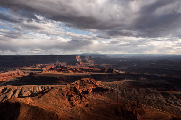 istock Moody and dramatic light and weather over desert canyon landscape 1368415395