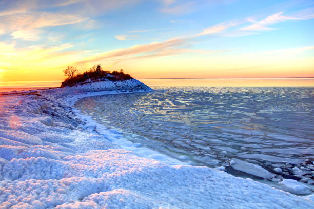 The ice of a lake is an icebound one under the blue sky in sunshine.