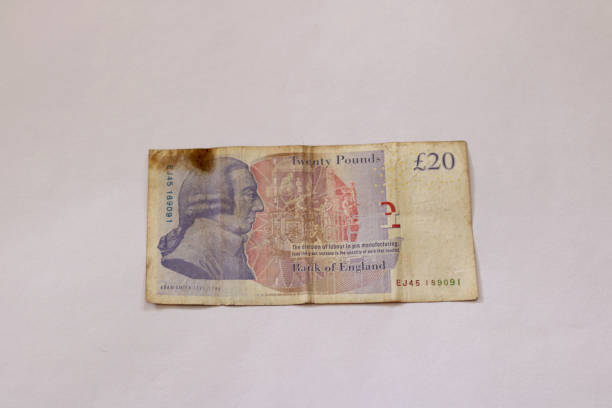 istock image of British twenty pound sterling currency note with isolated back ground 1368415694