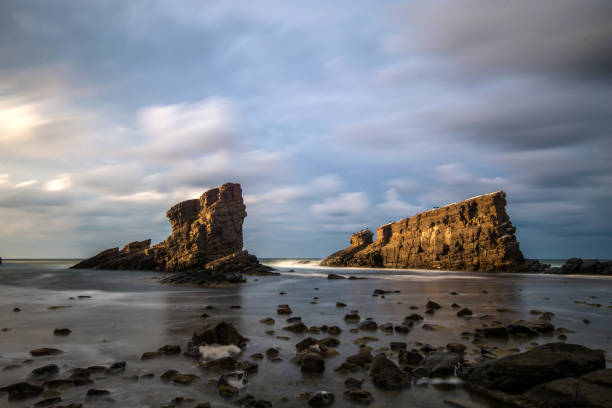 istock Seascape and magnificent dramatic sunrise over Rock formation The 1368415738