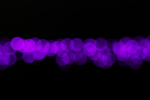 Abstract purple violet and white bokeh lights background