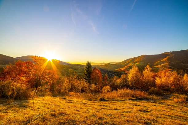 istock Sun sets behind forestry mountains in highland in autumn 1368419194