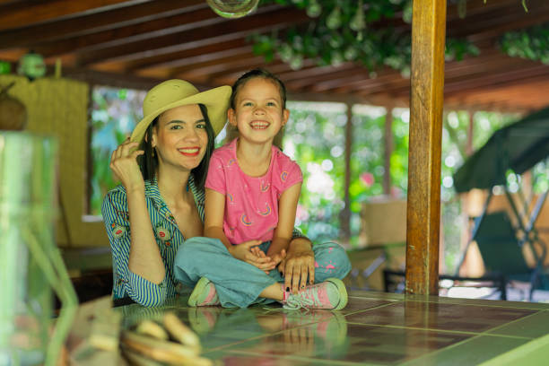 istock Mom and daughter look at the camera while on their farm 1368420698
