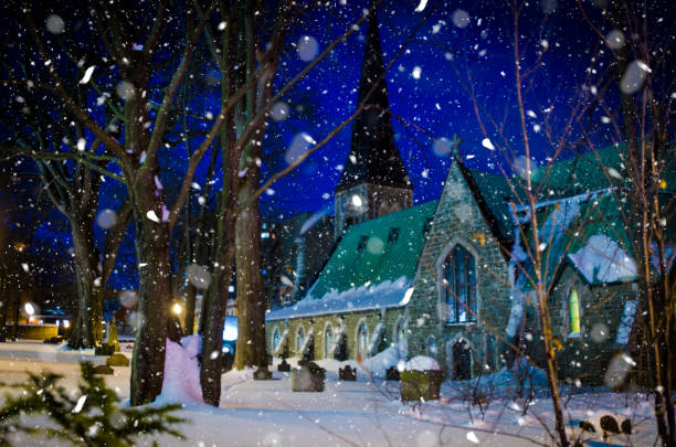 istock Tombstone and church during winter night 1368422055