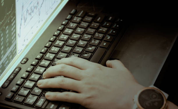 istock hand use computer app for stock investment 1368422834