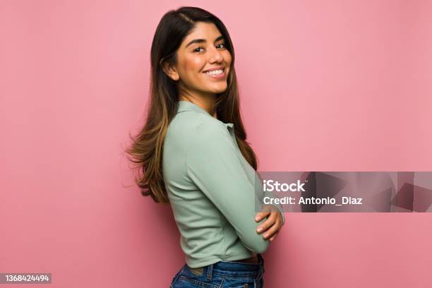 Studio Portrait Of A Cheerful Woman Stock Photo - Download Image Now - Women, Portrait, Colored Background
