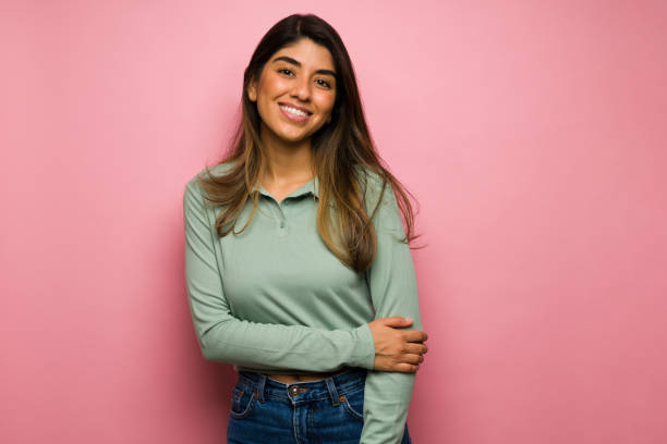 istock Confident young woman smiling 1368424888