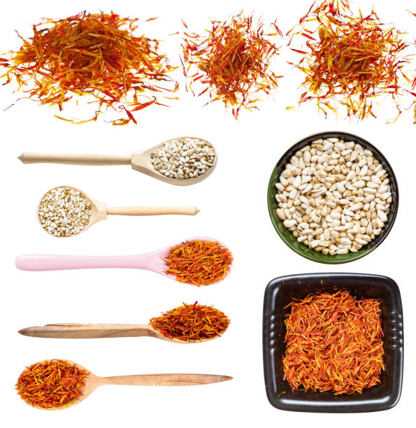 set of various safflower seeds and flower isolated set of various safflower seeds and flowers isolated on white background substitute for saffron stock pictures, royalty-free photos & images