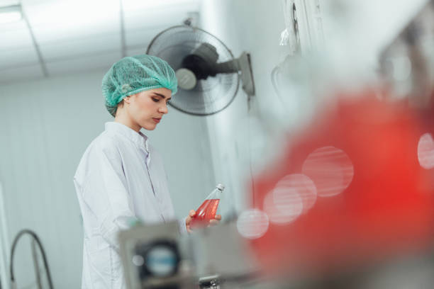istock workers inspecting production line at drinks production factory. workingConcept 1368427485