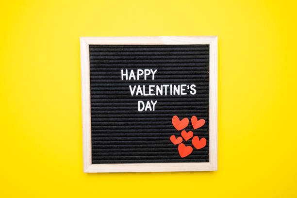 istock Happy valentine's day, text on yellow background top view 1368431102