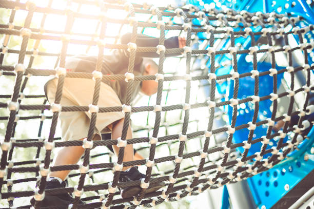 Children on a play structure in school uniform