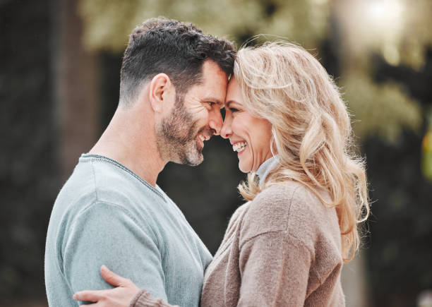 istock Shot of an affectionate mature couple standing outside 1368432641