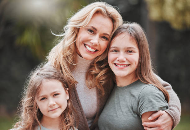 istock Shot of a woman spending time outdoors with her two daughters 1368432680
