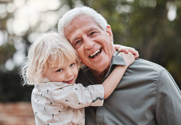 istock Shot of an elderly man spending time outdoors with his grandson 1368432706