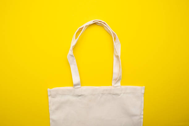 istock Eco bag on yellow background top view 1368433017
