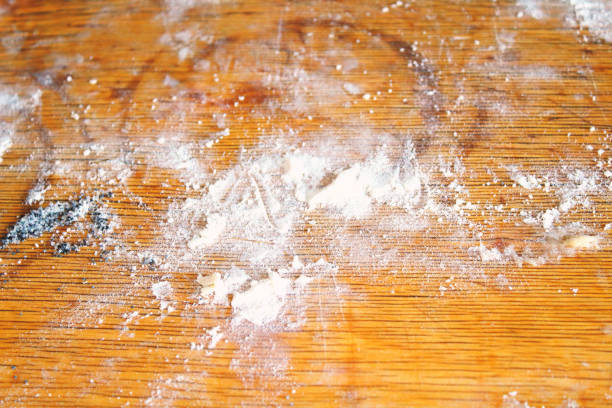 istock Flour on a wooden board. Background. Texture. 1368434537