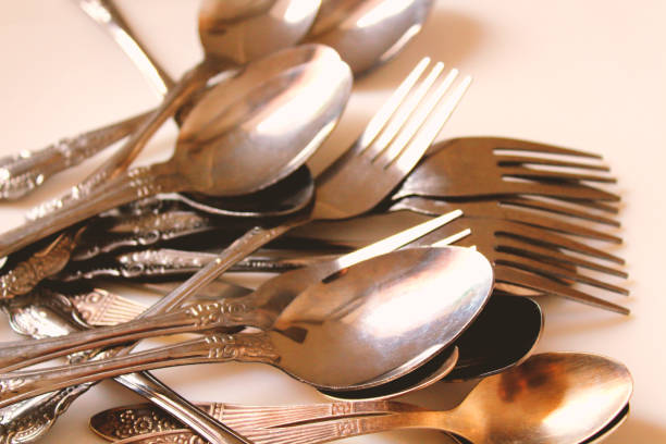 istock Metal old spoons and forks. Close-up. Background. 1368434542