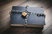 Book with chain and padlock. Information security