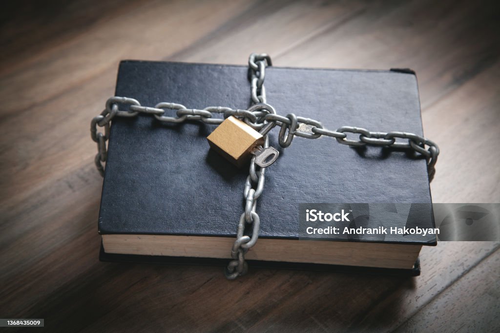 Book with chain and padlock. Information security Forbidden Stock Photo