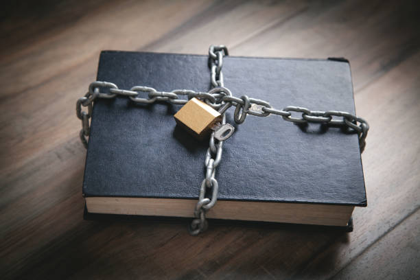book with chain and padlock. information security - censura imagens e fotografias de stock