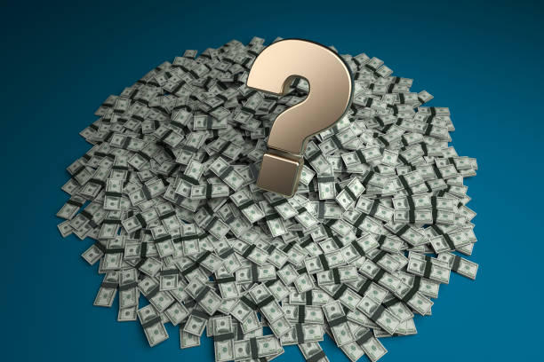 Gold-colored question mark symbol and the American one hundred dollar stack. On dark blue-colored background. Horizontal composition with copy space Focused image.