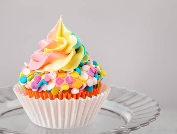 istock Rainbow Birthday Cupcake with Sprinkles 1368439142