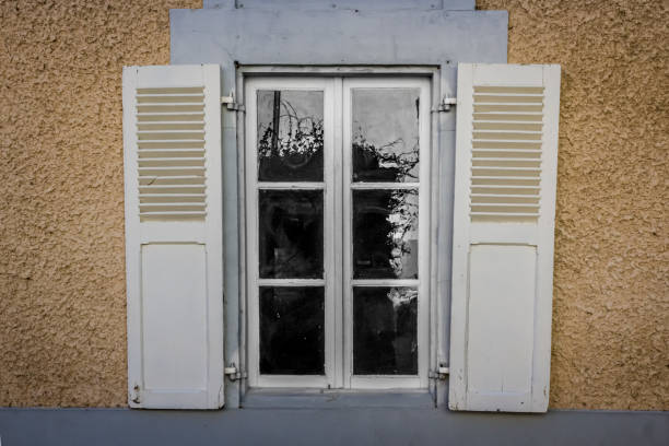 istock French windows with open and closed wooden shutters 1368439149