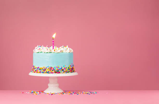 istock Blue Birthday Cake with Candle on pink 1368439191