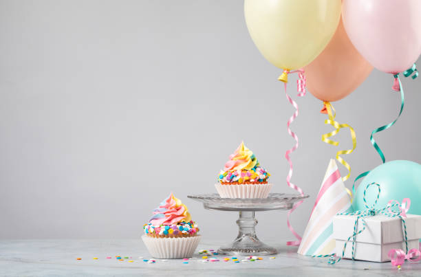istock Rainbow Birthday Cupcakes with Balloons 1368439233
